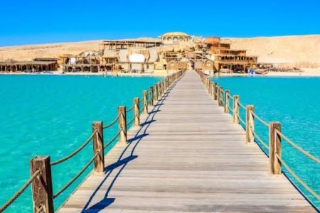 a wooden bridge over water orange bay island